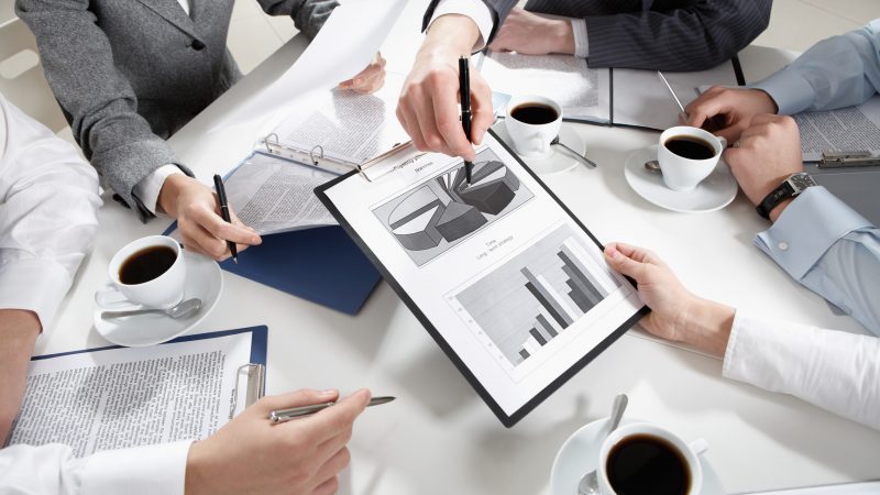 Image of human hands during discussion of business plans